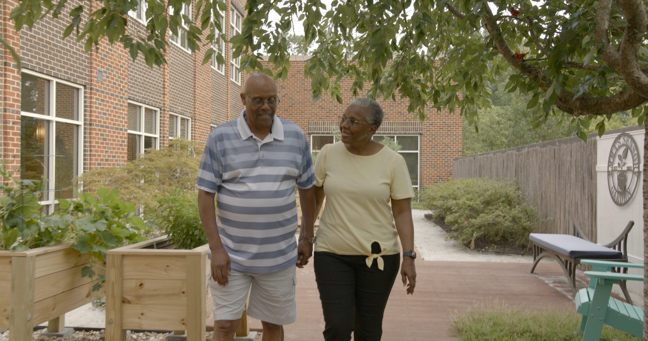 couple enjoying a leisurely stroll walking hand in hand in good health
